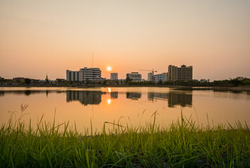 Wall Mural - Sunset with lake in Public Park landscape