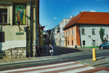 Fototapeta Sawanna - European architecture street view and a girl with a school bag, Krakow city Poland