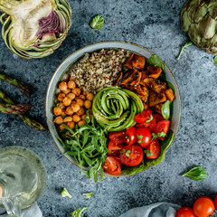 Wall Mural - Buddha bowl salad with baked sweet potatoes, chickpeas, quinoa, tomatoes, arugula, avocado, sprouts on light blue background with napkin. Healthy vegan food, clean eating, dieting, top view