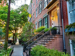 Wall Mural - Old brownstone buildings along a quiet street in the West Village neighborhood of Manhattan in New York City