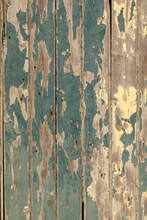 Wood With Yellow And Green Flaking Paint On Door Cracks In Door Portrait Orientation