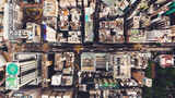 Fototapeta Miasta - Top view aerial photo from flying drone of a Hong Kong Global City with development buildings, transportation, energy power infrastructure. Financial and business centers in developed China town