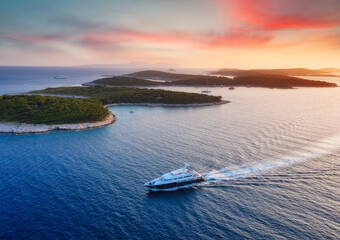 Wall Mural - aerial view on the luxury yacht during sunset. adventure and travel. landscape with ship on adriatic