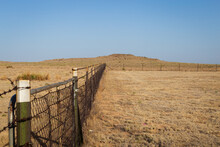 Rustic Farm Fence In A Dry Arid Prairie Landscape