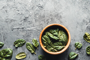 Wall Mural - Green food background on stone table top view. Healthy food, vegan, eco products.