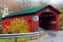 A Red Covered Bridge Highlights A Rainy, Late Fall Scene In Rural Vermont