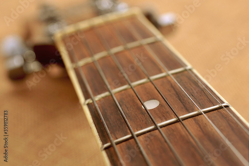 Fotomural The neck of the guitar close up.