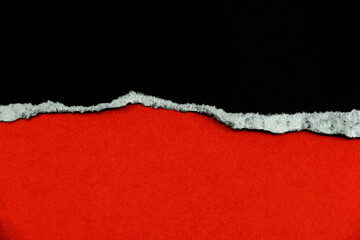 Wall Mural - Black torn paper on a red background that is for copying advertisements or text, images and designs.