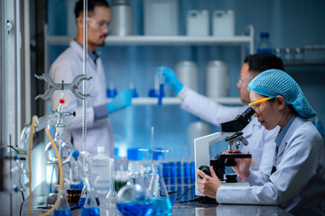 Wall Mural - scientist working with microscope in laboratory, medical science research