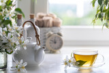 Spa resort at home with tea made of jasmine flowers on a white background. Copy space. Spa and wellness concept.