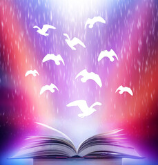 Poster - an abstract fantasy image opens an old book with birds flying out of the book as birds flying to the