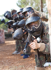 Wall Mural - Paintball players aiming with guns