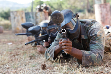 Wall Mural - Team playing paintball outdoor