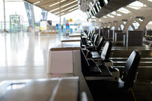 Empty Check-in Row Desks In International Airport