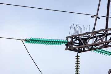 Power transmission tower closeup - high voltage electricity pole of the grid