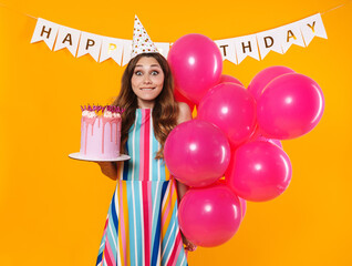 Wall Mural - Image of excited woman posing with pink balloons and birthday torte