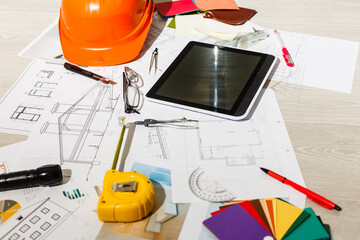 Tools and papers with sketches on the table