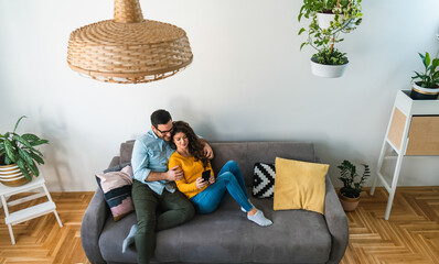 Couple looking mobile phone together stock photo