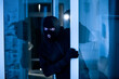 © Prostock-studio - Intruder breaking into apartment or office to steal something