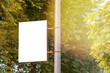 The blank advertising banner suspended on the street lamp pole
