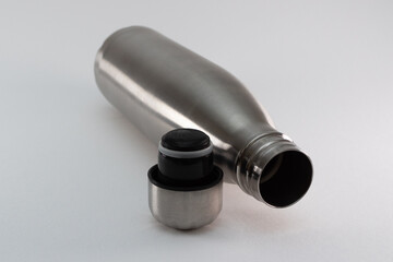 Metal flask, bottle for preservation of a hot or cold liquid on a white background.