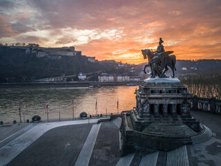 Wall Mural - Colorful Sunrise burning sky Koblenz City historic monument German Corner where river rhine and mosele flow together