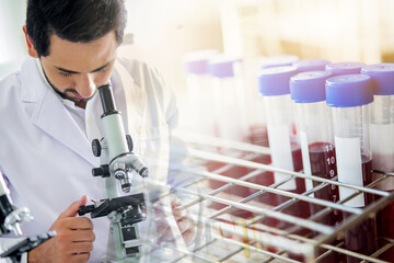 Wall Mural - lab technician assistant analyzing a blood sample service in test tube at laboratory with microscope
