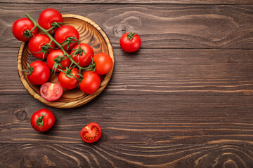 Sticker - Red ripe cherry tomatoes on wooden table