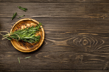 Sticker - Fresh rosemary sprigs on rustic kitchen table