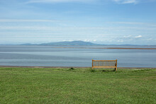 A Bench Looking Over Silloth Beach On A Warm Day.