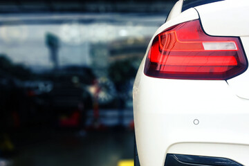 back of sport car was parked in the garage.