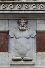 Detail of bas-relief of Arab character, base of the statues in front of the old building, Florence, Italy