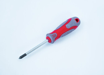 Screwdriver with a red handle on an isolated background. 