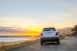 © Abhijit Patil/Austockphoto - Rear view of car at sunset
