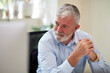 © Bec Hannaford/Austockphoto - Businessman sitting at a desk in an open office studio