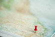 © Clare Farrelly/Austockphoto - Pin marking road trip destination on map