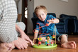 © Gary Radler/Austockphoto - Boy playing with an Educational Toy