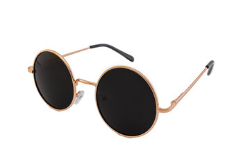 Street style oval sunglasses with thin golden metal frame, clear brown lens, isolated on white background, side view.