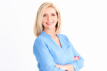 Wall Mural - Portrait of attractive blond haired woman looking at camera and smiling at isolated white background