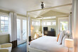 © Trinette Reed/Stocksy - Canopy bed in luxury hotel room