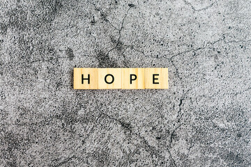 Wall Mural - Hope text on wooden block textures background