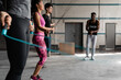 © Milles Studio/Stocksy - Trainer setting pace for skipping athletes