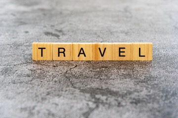 Wall Mural - Travel text on wooden block textures background