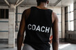 © Milles Studio/Stocksy - Anonymous black coach in gym