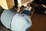 Fototapeta Storczyk - Sewing Machine Stitch Letters On Cap.  Souvenir with own name and city name from Benalmadena, Spain.