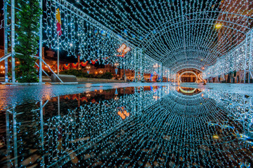 Tunnel of lights reflected in the water