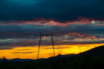 Canvas Print - pylons of Electricity at the sunset