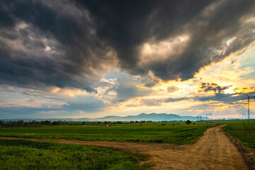 Poster - Clouds at the sunset view from the top of the hill