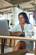 © puhhha - Job. Business Woman Working At Cafe. Fashion Girl In Glasses Typing On Laptop. Freelancer Having Online Meeting In Restaurant. Smiling Female At Comfortable Workplace.