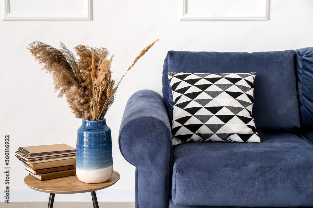 Interior of modern room with table and sofa